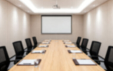 Blurred interior of a modern corporate conference room with projector screen awaiting important business meetings and presentations