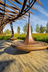 park bench in the form of a children's toy spinning top
