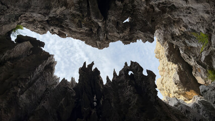 sharp cliffs and unusual places while looking up at the sky from deep pit