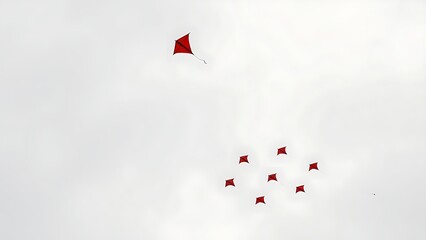 kite. A single red kite drifting away from a formation in the sky. event key visuals, club posters, designed for sports event promotions and stadium branding, used by fitness trainers.
