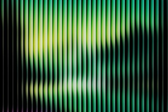 Abstract neon green vertical lines background with grainy noise texture, dark retro futuristic gradient pattern, modern cyberpunk glitch stripe design for digital wallpaper