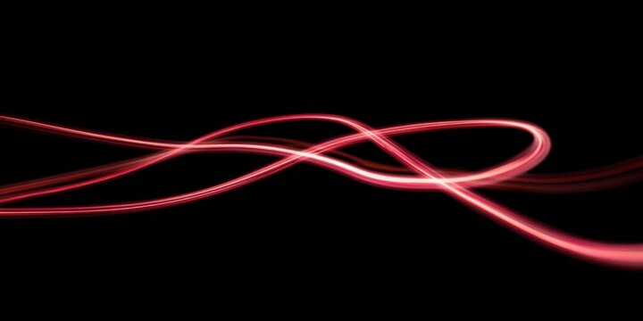 Abstract glowing red neon light trails on black background