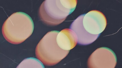 Abstract background featuring blurred circles with chromatic aberration effect on a dark backdrop