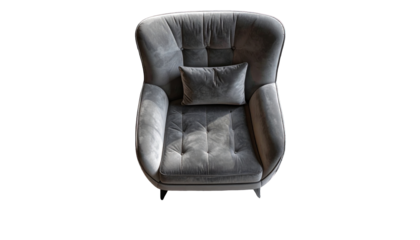 Overhead shot of a plush, button-tufted gray armchair with a matching lumbar pillow