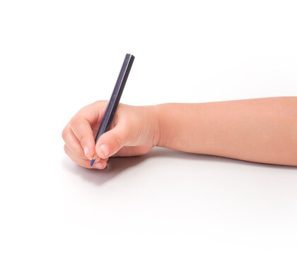 Childs hand holding a blue pencil, writing on a white background. - Powered by Adobe