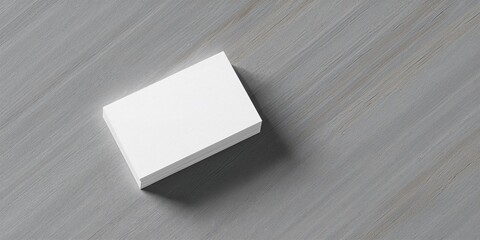 Blank business cards arranged on a grey wooden surface for professional networking