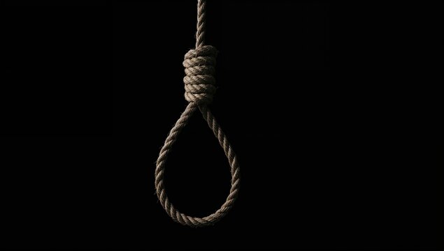 Concept of suicide: a noose against a dark background