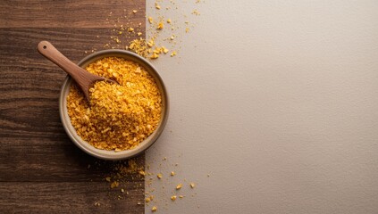 Nutritional yeast in a ceramic bowl with a wooden spoon, used as a nutrient-dense vegan supplement, World Vegan Day