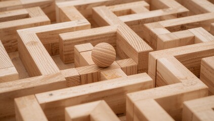 Wooden ball and labyrinth game constructed from blocks, challenge of navigating through complex pathways