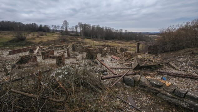 Historic remnants of a deserted mining site and detention center, preservation