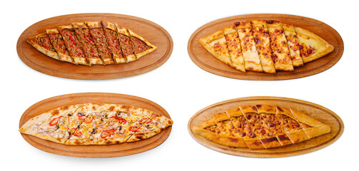 Delicious bread boats with various fillings served on wooden platters