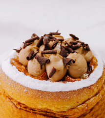 Delicious pastry topped with chocolate mousse and chocolate shavings