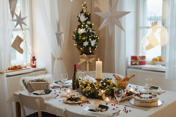 A table set for dinner meal at Christmas time.