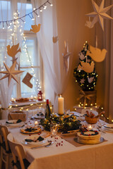 A table set for dinner meal at Christmas time.