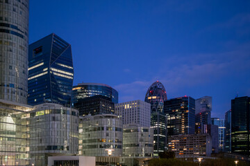 Architecture skyscrapers skyline night corporate finance urban modern across la defense paris france delivering a refined business backdrop with clear contemporary geometry