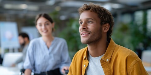 Young diverse team collaborating in modern office environment with focused discussion