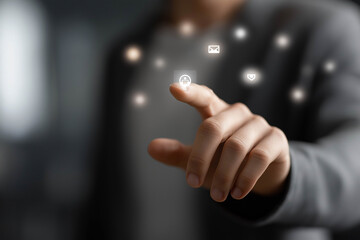 Hand of a business professional interacting with digital icons, showcasing technology and innovation in a modern workspace with a blurred background and engaging atmosphere