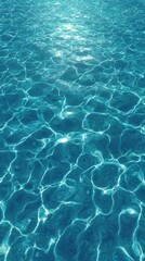 Obraz premium Sparkling Ocean Surface: A captivating shot of the shimmering ocean surface, where sunlight dances on the clear water, creating an inviting, tranquil visual.