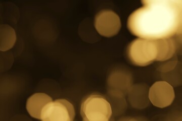 Obraz premium Golden orbs of light creating a magical ethereal glow on a dark background