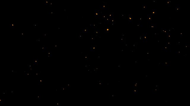 Shimmering dust particles fly in the air with fire embers and sparks on black background, abstract bokeh dust floating slow motion, surreal ember fire dust rising up, 4K loop overlay.
