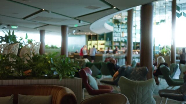 Luxury restaurant lounge interior with soft defocused bokeh and blurred seating background cafe; background backplate copyspace calm.