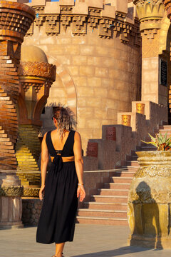 portrait of beautiful woman standing near the al sahaba mosque, sharm el sheikh	