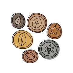Fototapeta premium Decorative coins with leaf and star designs in earthy colors 