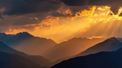 Obraz premium Majestic Sunset Over Mountain Range with Dramatic Cloud Formation Highlighting the Beauty of Nature and the Serenity of the Landscape in Vibrant Orange and Yellow Hues