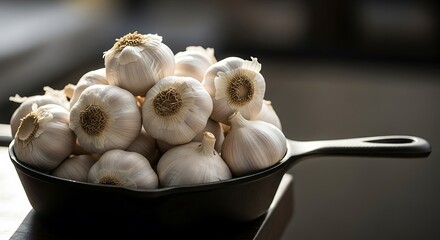 Garlic bulbs heaped in a cast iron pan for culinary inspiration
