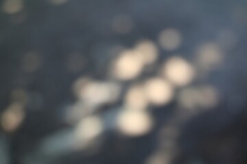 Subtle highlights dance across a deep textured background creating an atmospheric mood