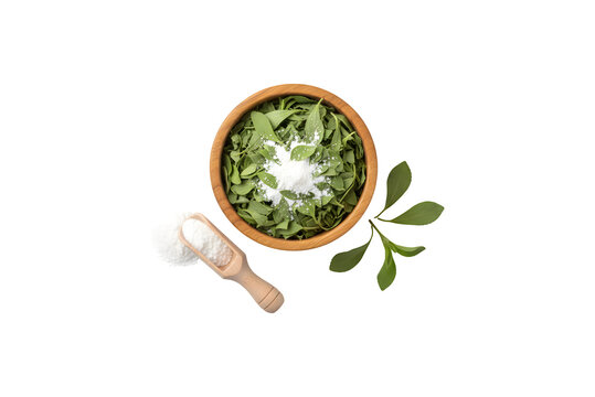 Stevia leaves and stevia powder in a wooden bowl, set against a white background.


