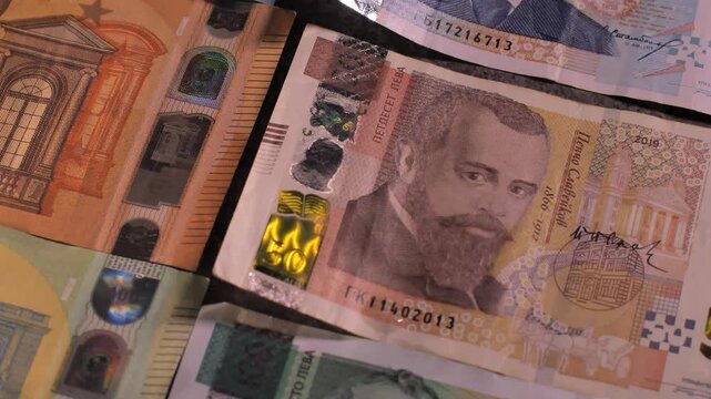 Bulgaria change currency, Bulgaria Lev to Euro. Money exchange. Paper banknotes on table. Concept, economy, competition, crisis, banking and finance. BGN,BGL. Scene D. Close up slide shot.