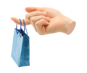 Hand holds mini shopping bag, isolated on transparent background, shopping concept. Contemporary art design