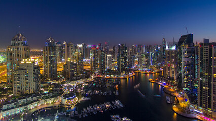 Dubai marina harbor panorama from night to day transition timelapse