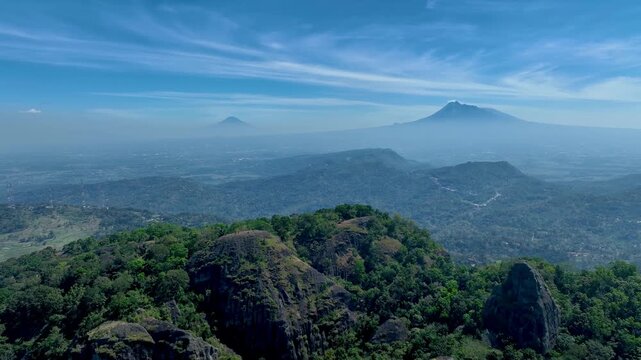 Morning Drone Panorama of Nglanggeran Ancient Volcano in Gunung Kidul with Distant Merapi and Merbabu Peaks