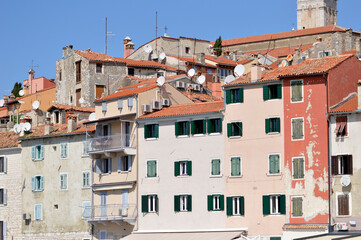 windows in old town of Rovinj with colorful wooden blinds