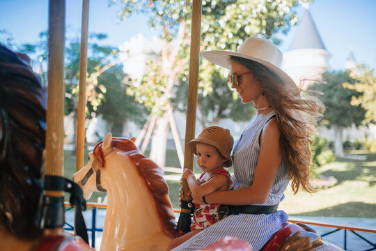 Mother and child enjoying carousel ride in Nha Trang