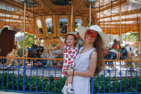 Mother and child enjoying a day at the carousel