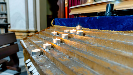 Candles lit in Chiesa di San Vincenzo in Cernobbio