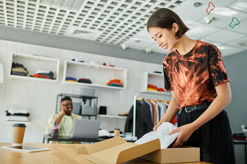 Young entrepreneurs collaborate in a vibrant print studio environment