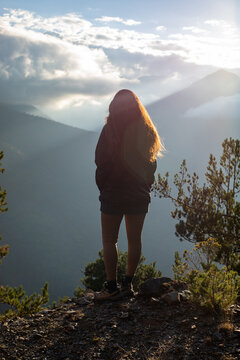 Woman enjoying a sunset view in the Pyrenees