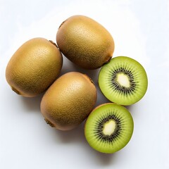 Fototapeta premium Freshly sliced and whole ripe kiwifruit on a clean white background, showcasing vibrant green flesh and black seeds