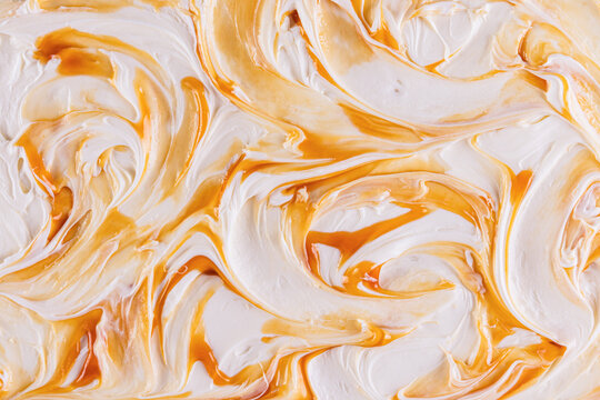 Swirled ice cream texture with caramel topping