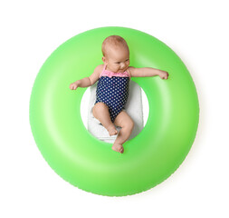 Cute little baby on inflatable ring against white background, top view