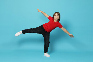 Obraz premium Full length portrait of cute boy on light blue background
