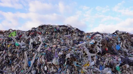 Impact of waste management at a landfill site in urban environment on a sunny day - Powered by Adobe