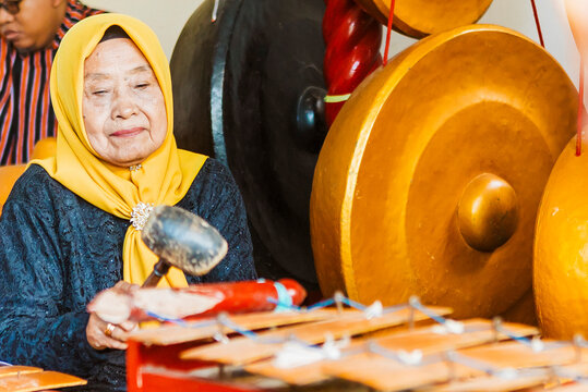 Javanese gamelan musician playing traditional music