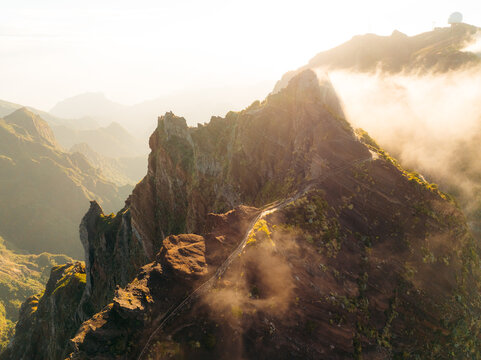 Scenic mountain view shrouded in mist at sunrise in Madeira
