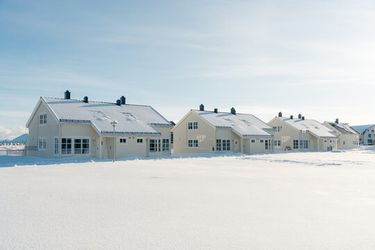 Snow covered houses in Lofoten winter landscape
