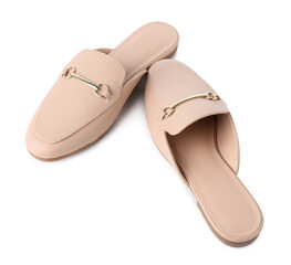 Pair of stylish beige mule shoes isolated on white